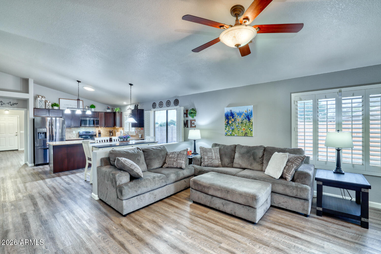2206 East Ruby Lane Phoenix, AZ 85024 - Photo 12 of 29 a living room with furniture and a wooden floor
