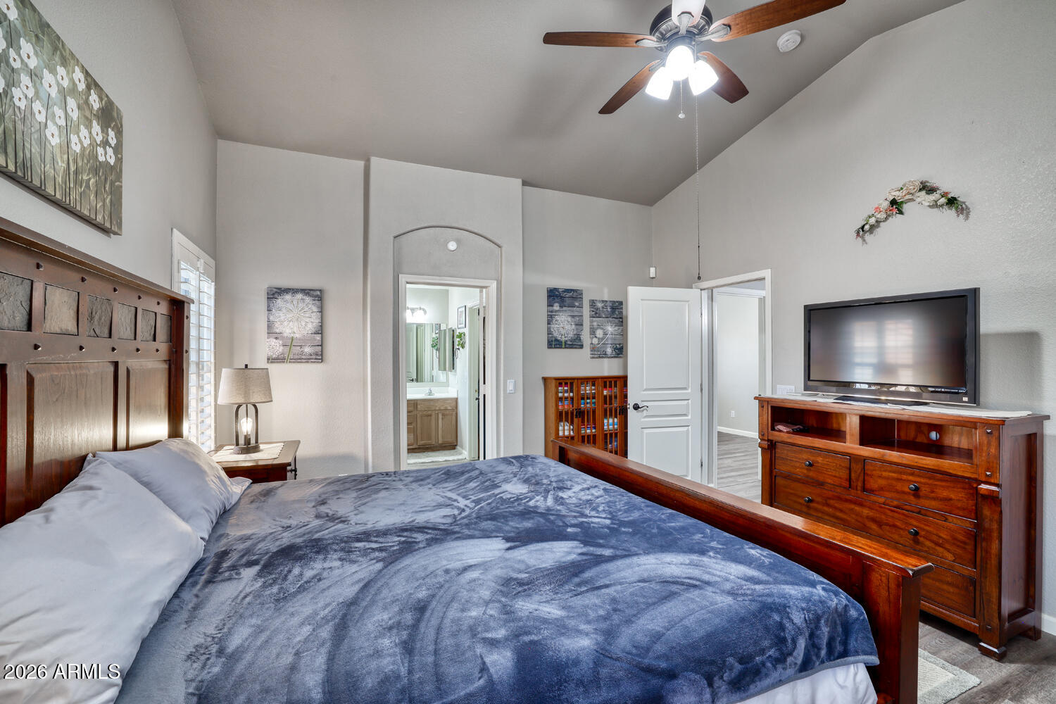 2206 East Ruby Lane Phoenix, AZ 85024 - Photo 15 of 29 a bedroom with furniture and a flat screen tv