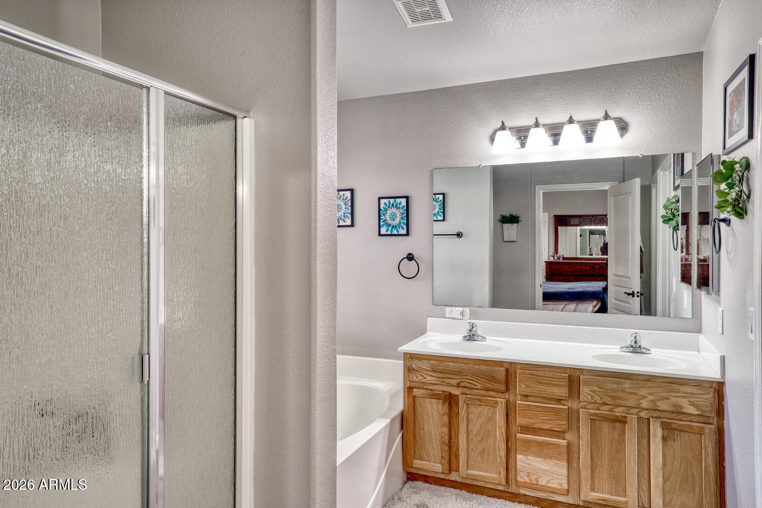 2206 East Ruby Lane Phoenix, AZ 85024 - Photo 16 of 29 a bathroom with a double vanity sink and a mirror