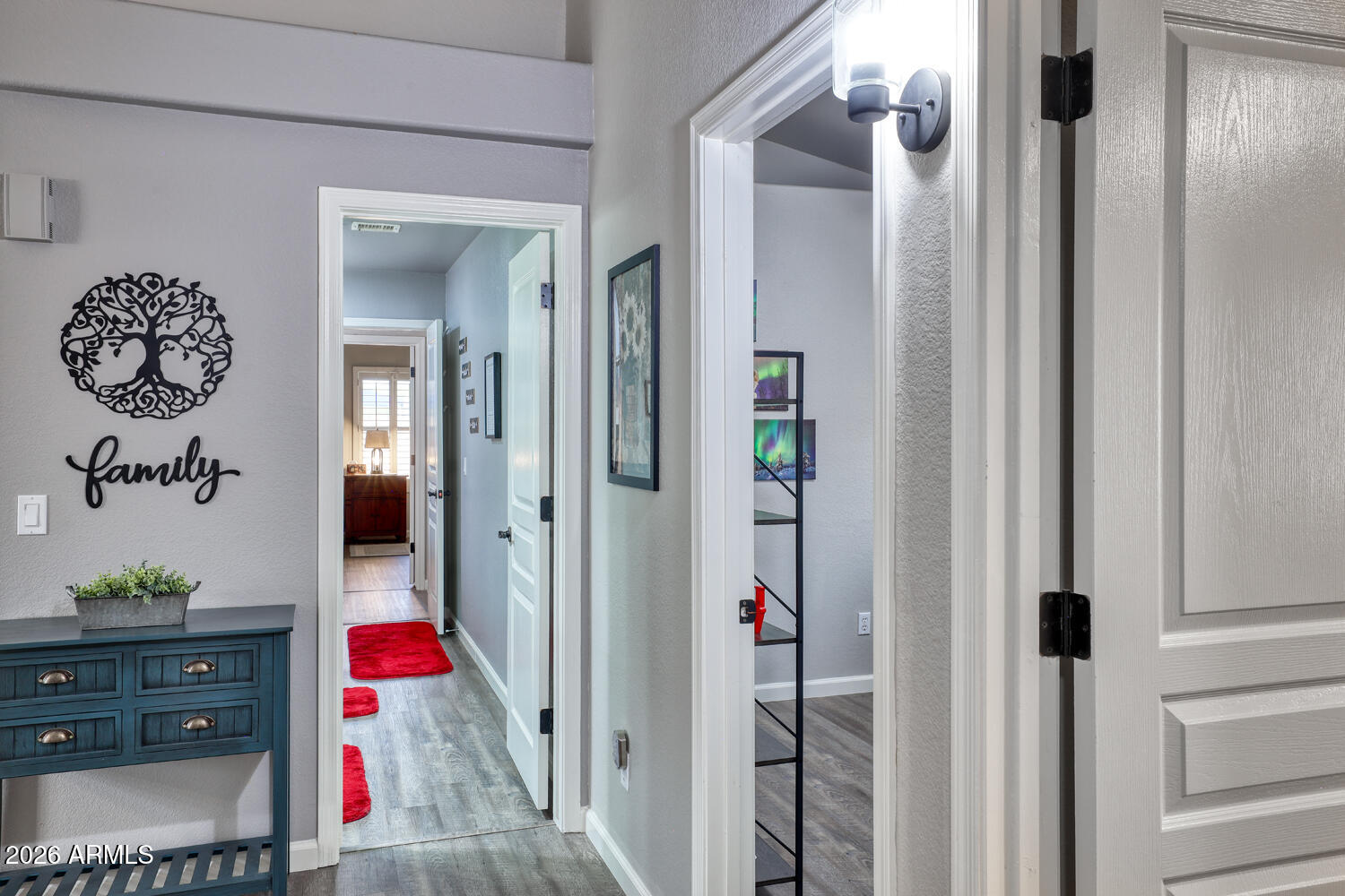 2206 East Ruby Lane Phoenix, AZ 85024 - Photo 17 of 29 a view of a hallway with wooden floor and closet