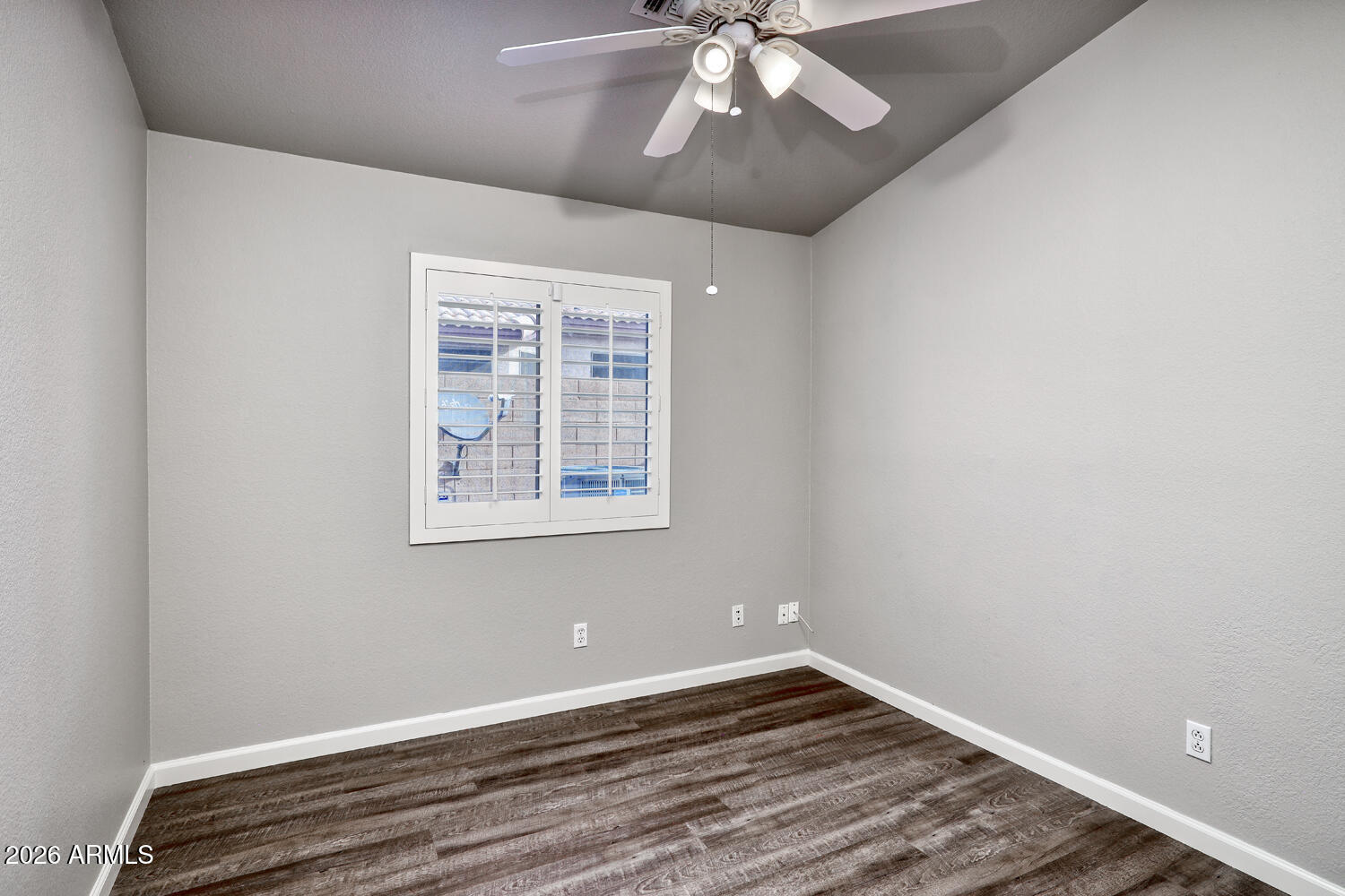 2206 East Ruby Lane Phoenix, AZ 85024 - Photo 22 of 29 wooden floor in an empty room with a window