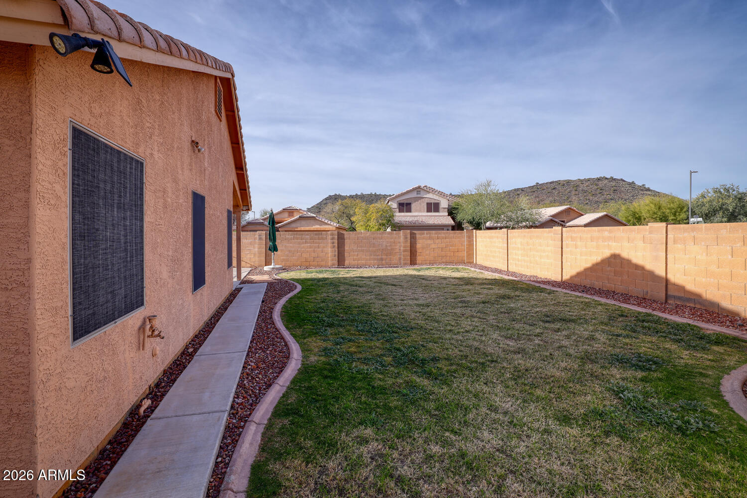 2206 East Ruby Lane Phoenix, AZ 85024 - Photo 26 of 29 a view of a house with a yard