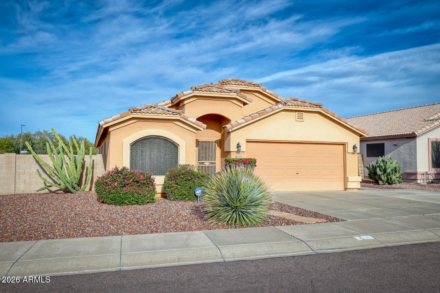 2206 East Ruby Lane Phoenix, AZ 85024 - Photo 3 of 29 a front view of a house with a garden