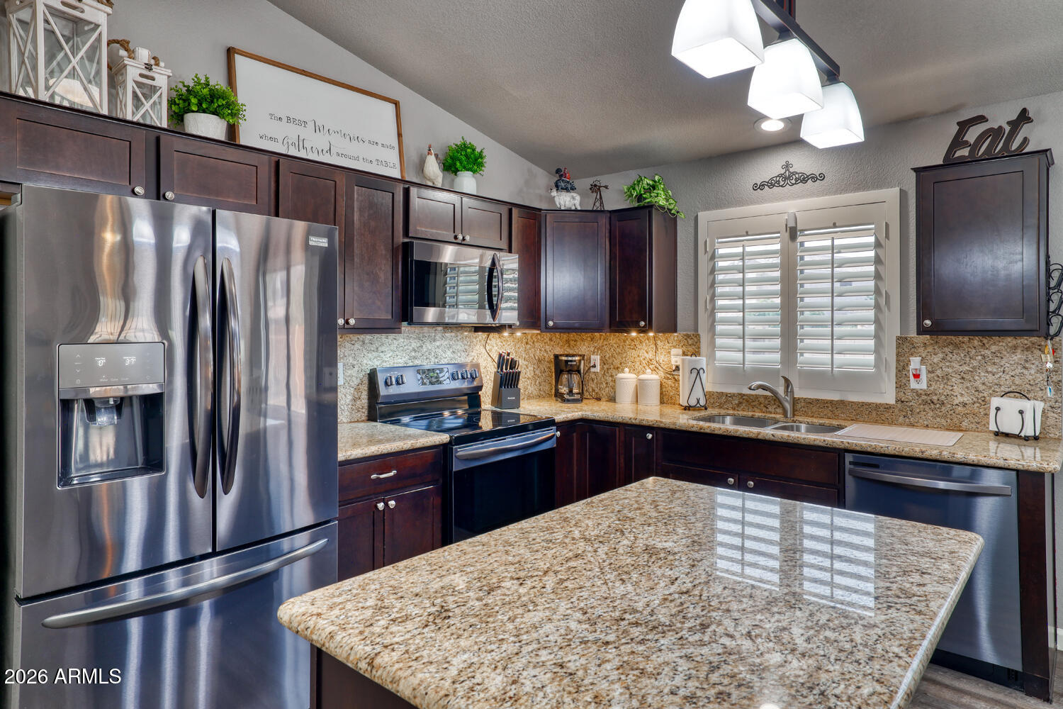 2206 East Ruby Lane Phoenix, AZ 85024 - Photo 8 of 29 a kitchen with stainless steel appliances granite countertop a refrigerator a sink dishwasher a stove and a refrigerator