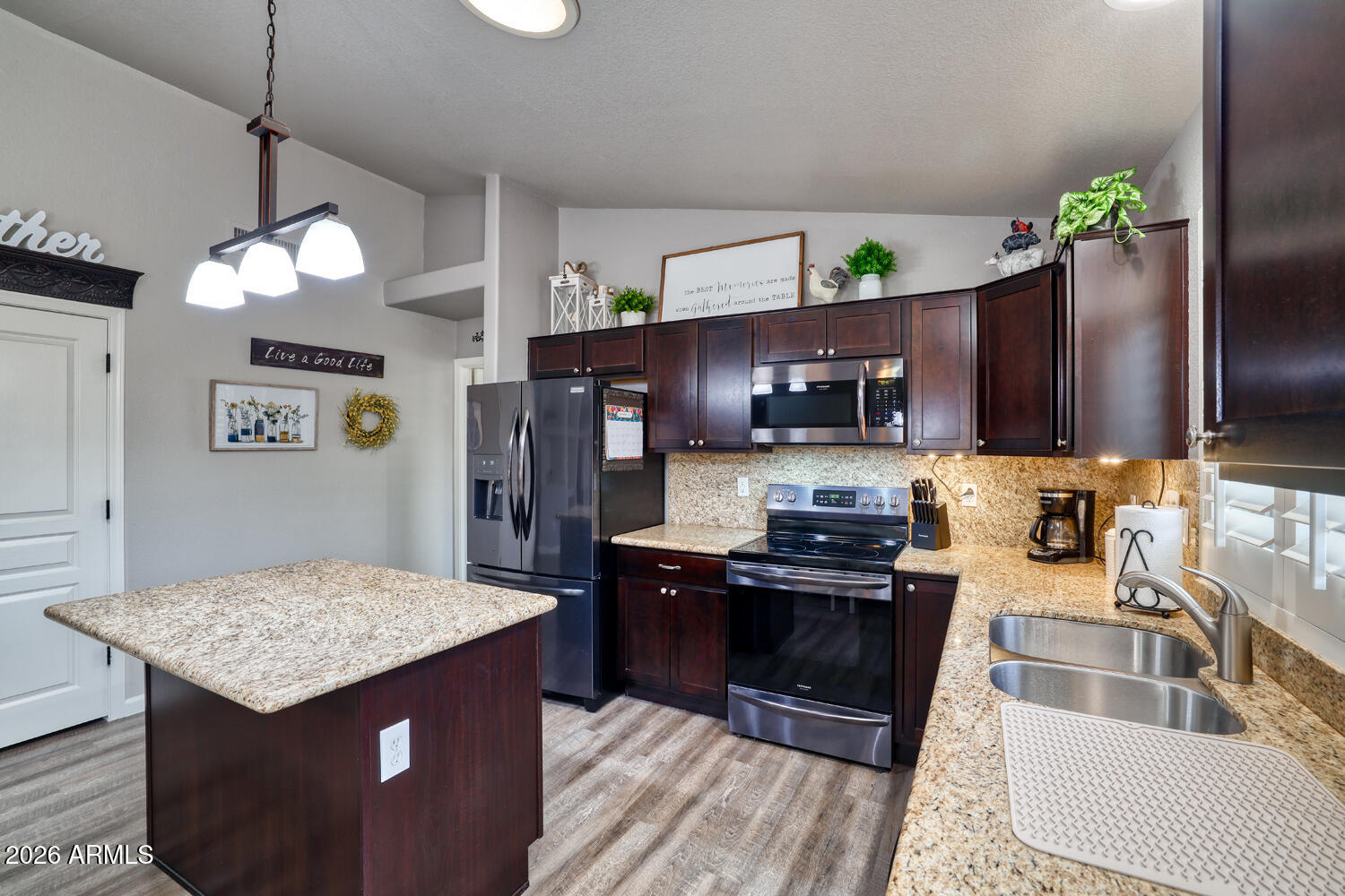 2206 East Ruby Lane Phoenix, AZ 85024 - Photo 9 of 29 a kitchen with stainless steel appliances granite countertop a stove refrigerator and microwave