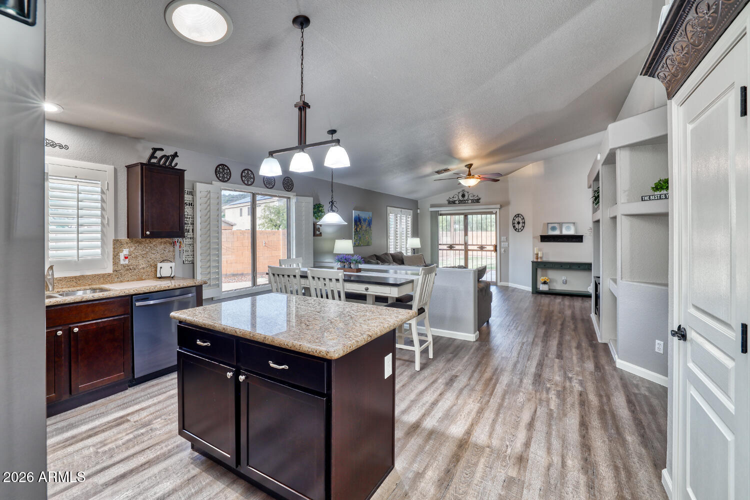 2206 East Ruby Lane Phoenix, AZ 85024 - Photo 10 of 29 a kitchen with a sink stove and wooden floor