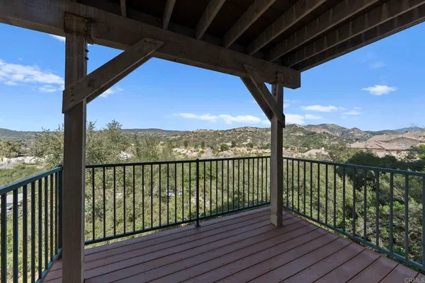 an aerial view of a house roof deck and outdoor seating