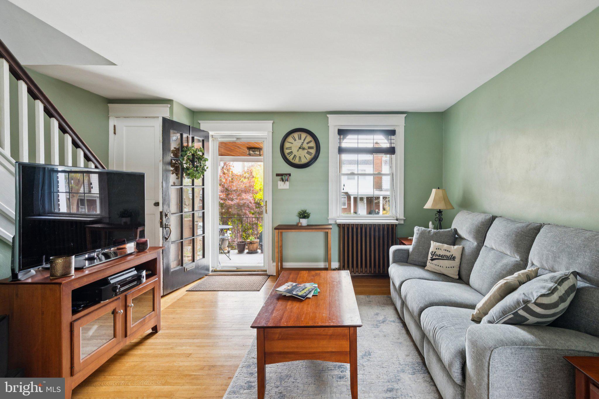 3419 Tilden Street Philadelphia, PA 19129 - Photo 3 of 16 a living room with furniture a flat screen tv and a window