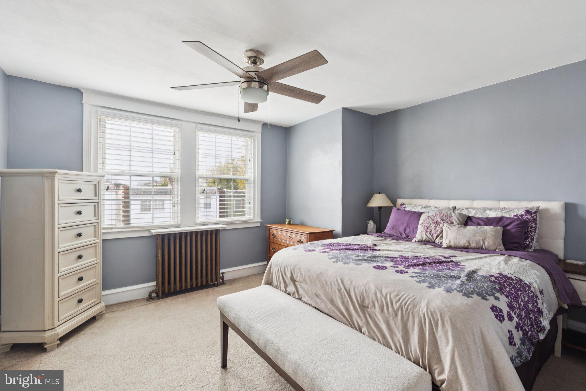 3419 Tilden Street Philadelphia, PA 19129 - Photo 8 of 16 a bedroom with a large bed and a window