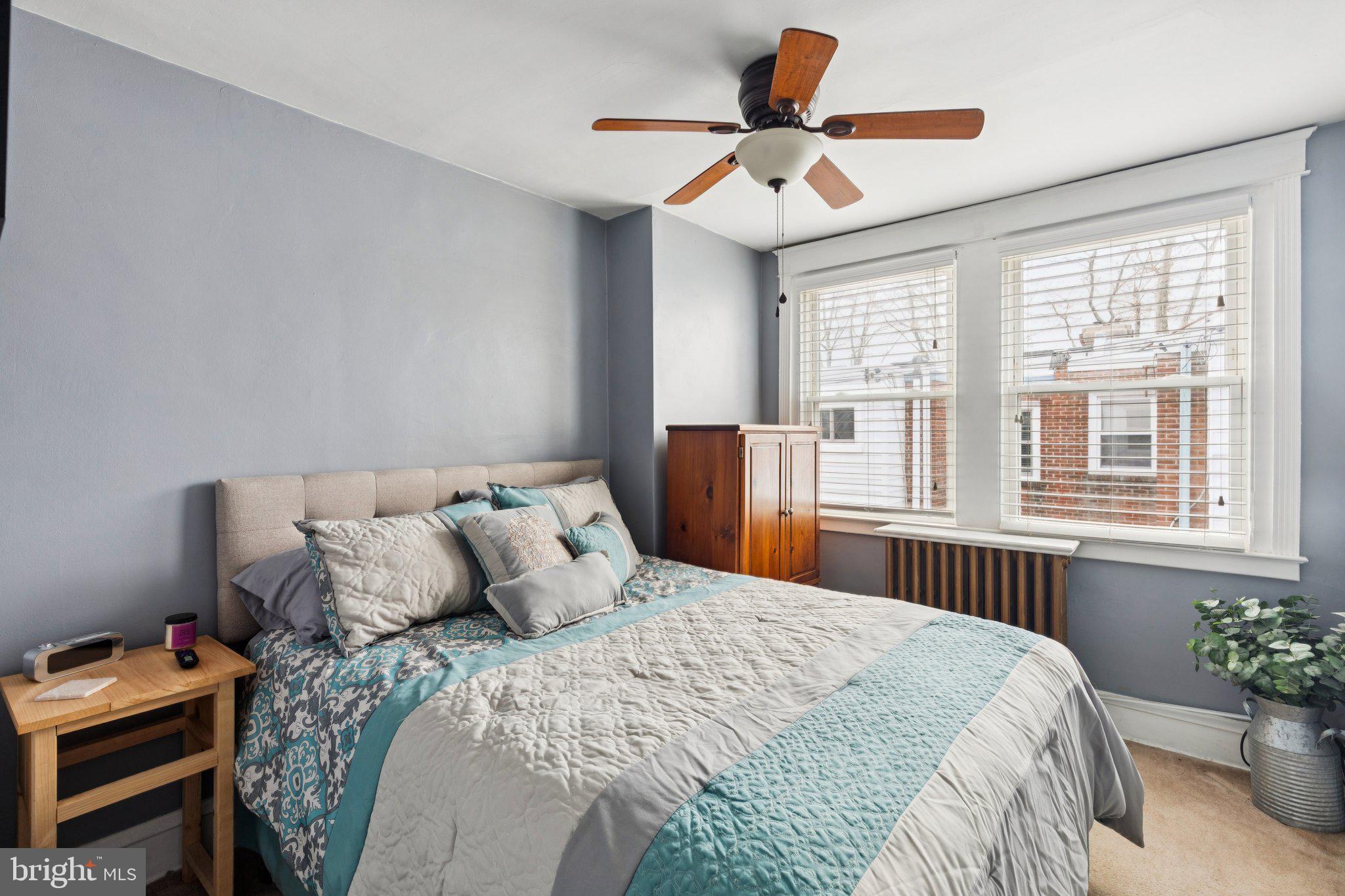 3419 Tilden Street Philadelphia, PA 19129 - Photo 9 of 16 a bedroom with a large bed and a large window