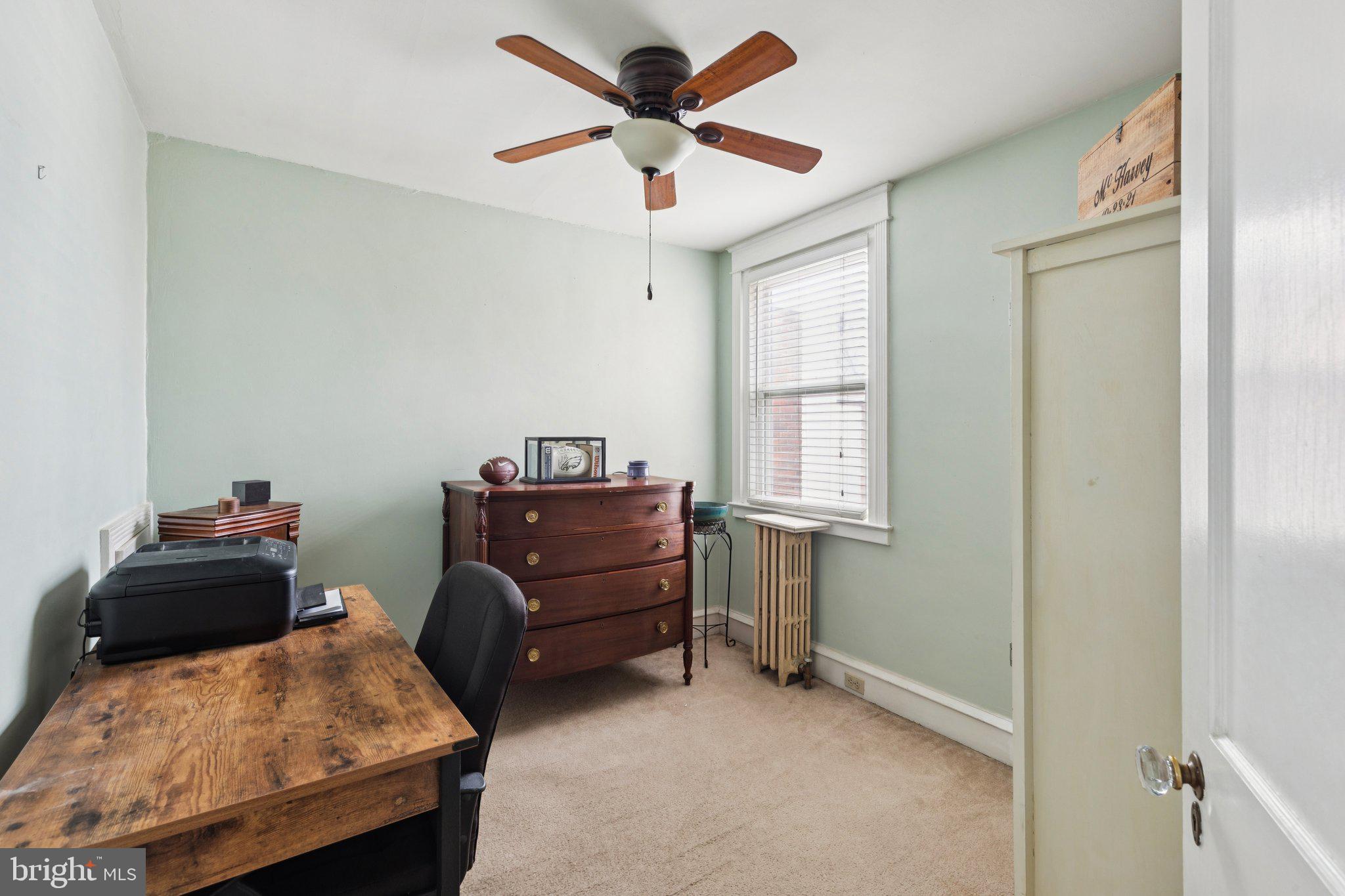 3419 Tilden Street Philadelphia, PA 19129 - Photo 10 of 16 a living room with furniture and a window