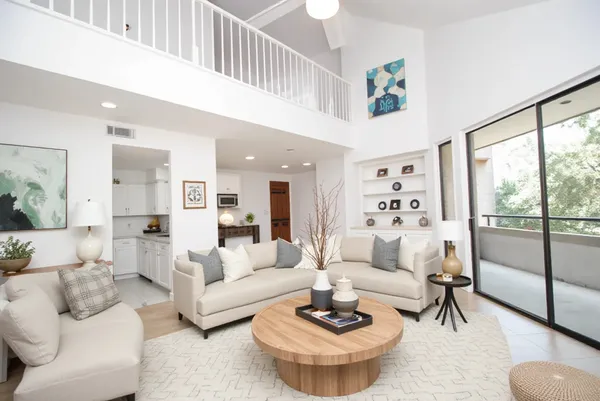 a living room with furniture and a large window