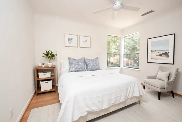 a bedroom with a bed and a couch