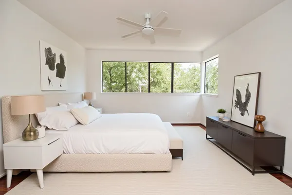 a bedroom with a bed and window