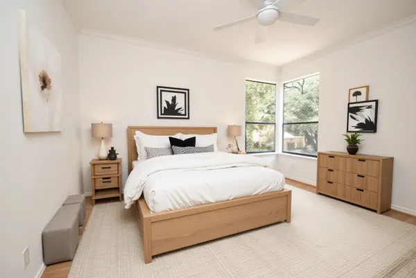 a spacious bedroom with a bed and a window