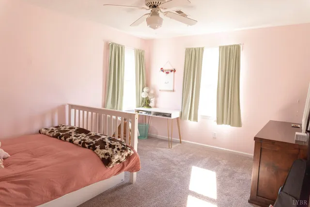 a bed room with a bed and a dresser