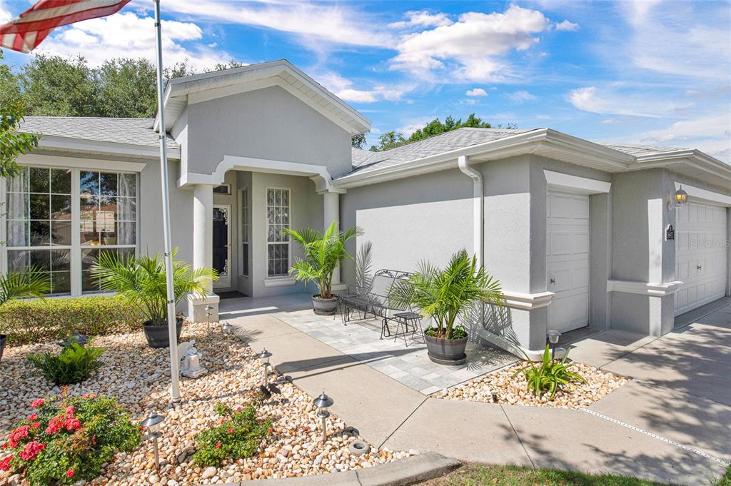 16411 Southwest 14th Avenue Road Ocala, FL 34473 - Photo 2 of 59 a view of a house with chair in front of house