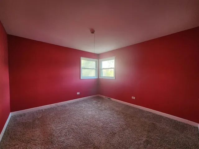 an empty room and windows