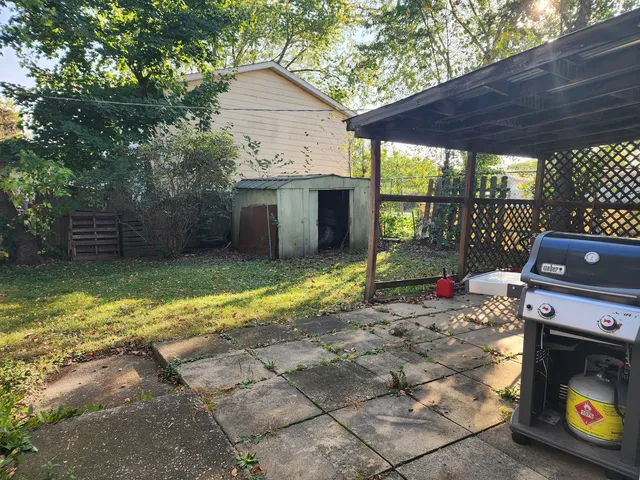 a view of a room with a small yard