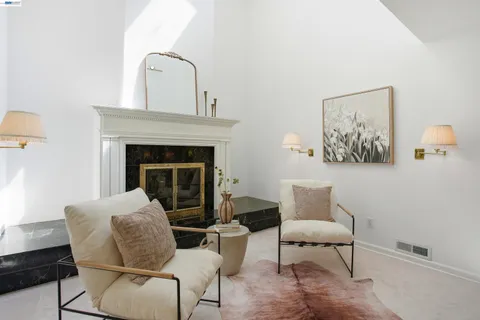 a bedroom with a bed and a lamp on table