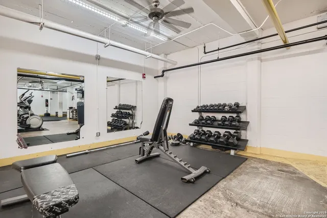 a view of a room with table and chairs