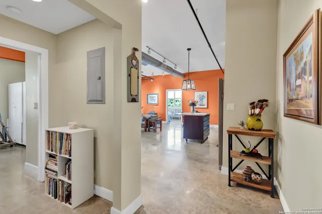 a dining room with furniture and a chandelier