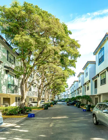a city street lined with buildings and cars