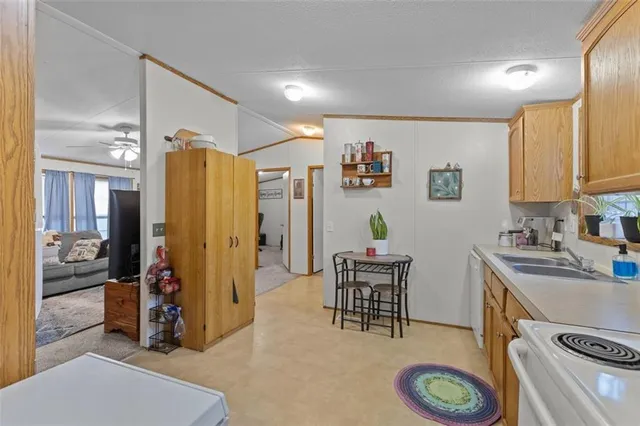 a view of kitchen center island and stainless steel appliances