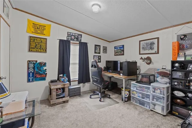 a view of a livingroom with workspace and a couch