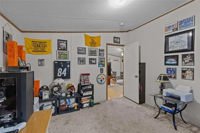 a bedroom with furniture and a fan