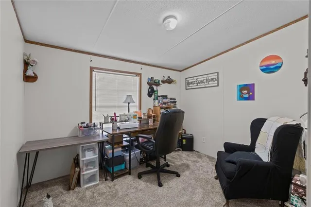 a view of a workspace with furniture