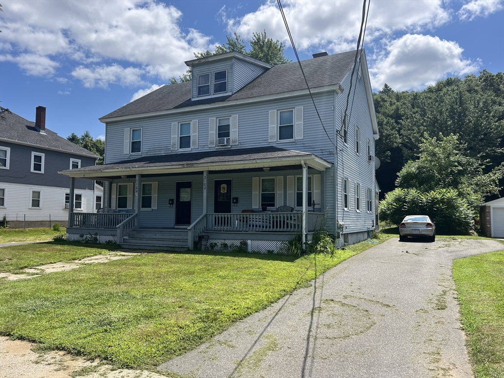 2102-2104 Palmer Road Three Rivers, MA 01080 - Photo 1 of 15 a view of a house with a yard and plants
