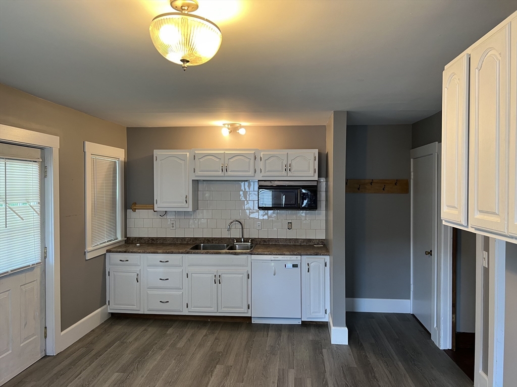 2102-2104 Palmer Road Three Rivers, MA 01080 - Photo 3 of 15 a kitchen with a sink and wooden floor