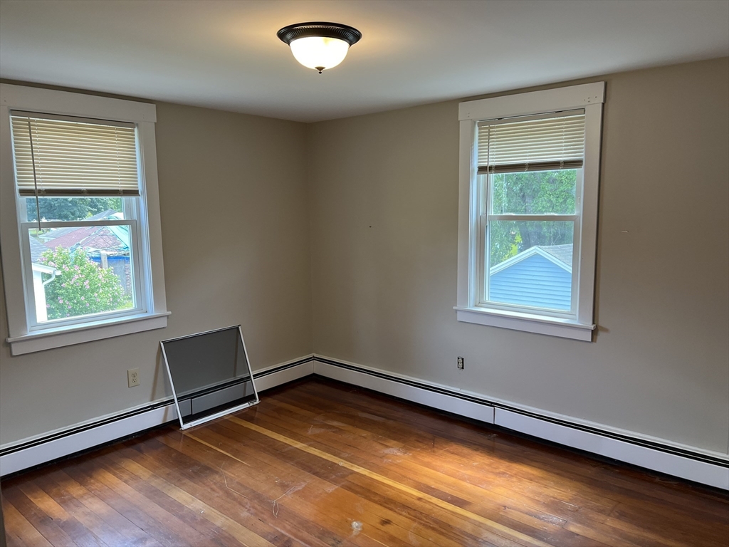 2102-2104 Palmer Road Three Rivers, MA 01080 - Photo 6 of 15 a view of a room with wooden floor and windows