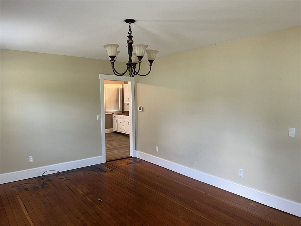 2102-2104 Palmer Road Three Rivers, MA 01080 - Photo 9 of 15 a view of a room with wooden floor and ceiling fan