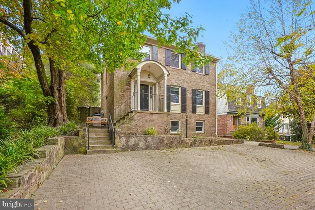 front view of a house with a street