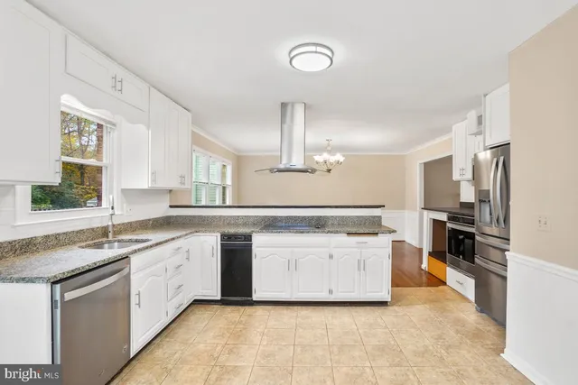 a kitchen with a sink stove and refrigerator