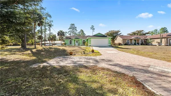 a view of backyard of a house