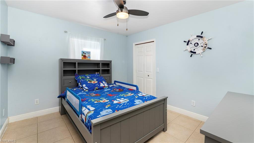 3340 2nd Avenue Southeast Naples, FL 34117 - Photo 17 of 25 a living room with furniture and a chandelier