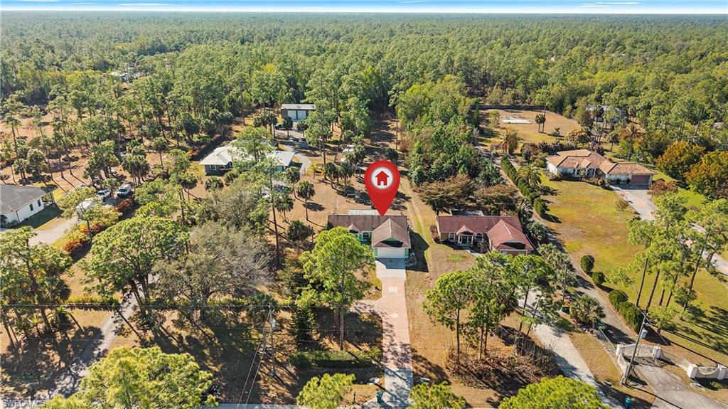 3340 2nd Avenue Southeast Naples, FL 34117 - Photo 21 of 25 an aerial view of residential house with parking and yard