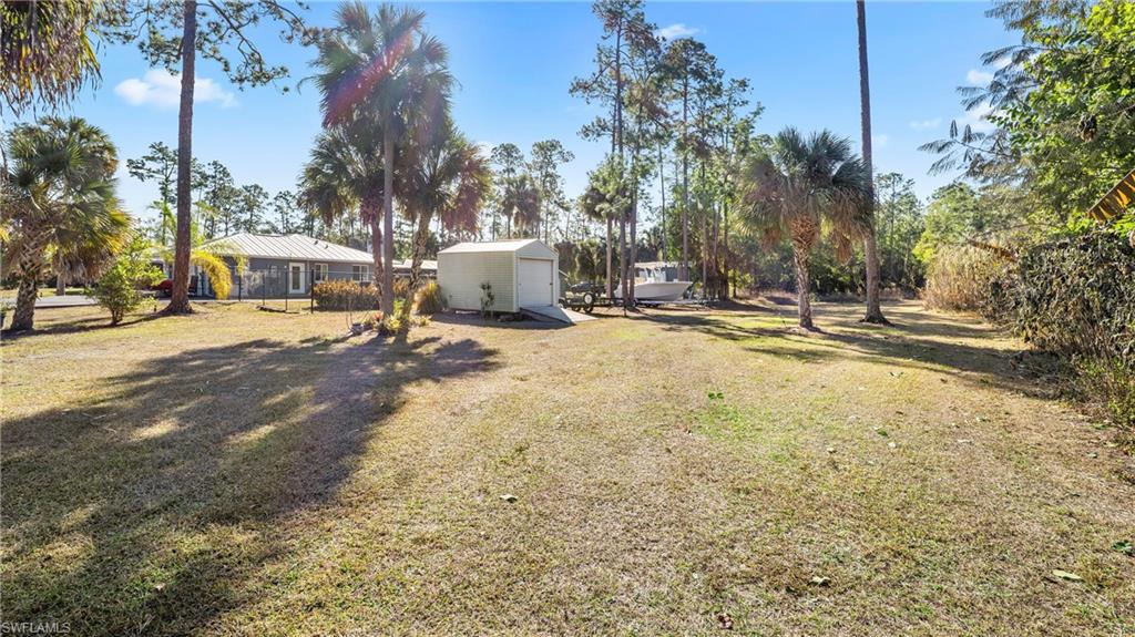 3340 2nd Avenue Southeast Naples, FL 34117 - Photo 25 of 25 a view of a yard with plants and trees