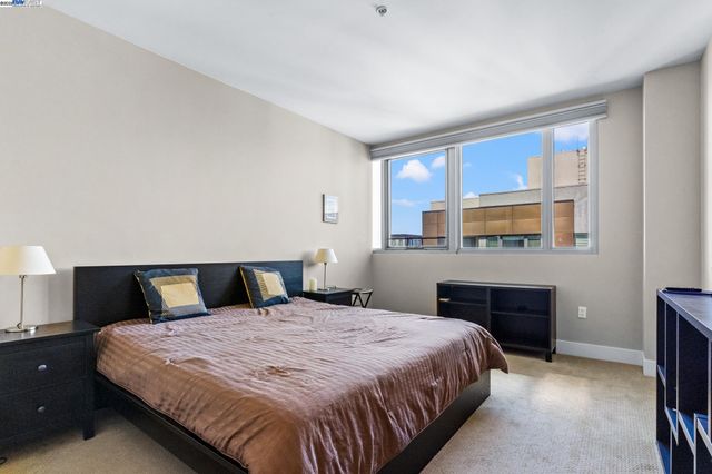 a bed room with a bed and a television