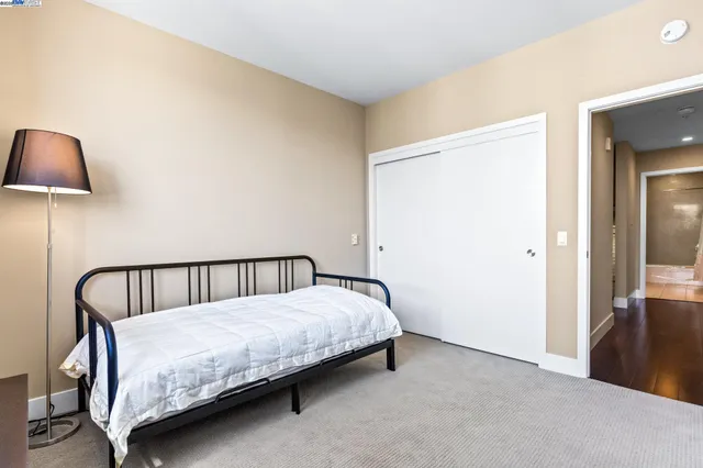 a living room with furniture and wall paintings