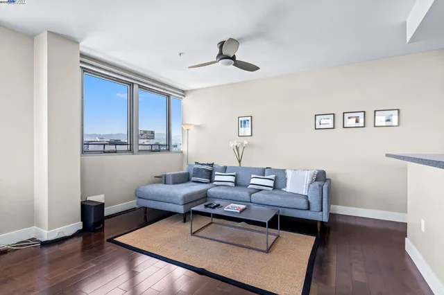 a view of kitchen with stainless steel appliances granite countertop a stove a sink and a refrigerator with wooden floor