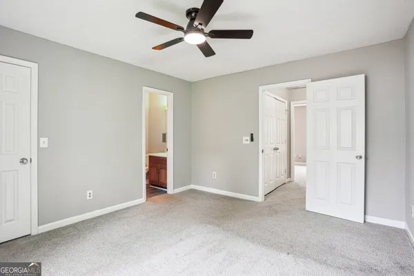 a view of an empty room and closet area