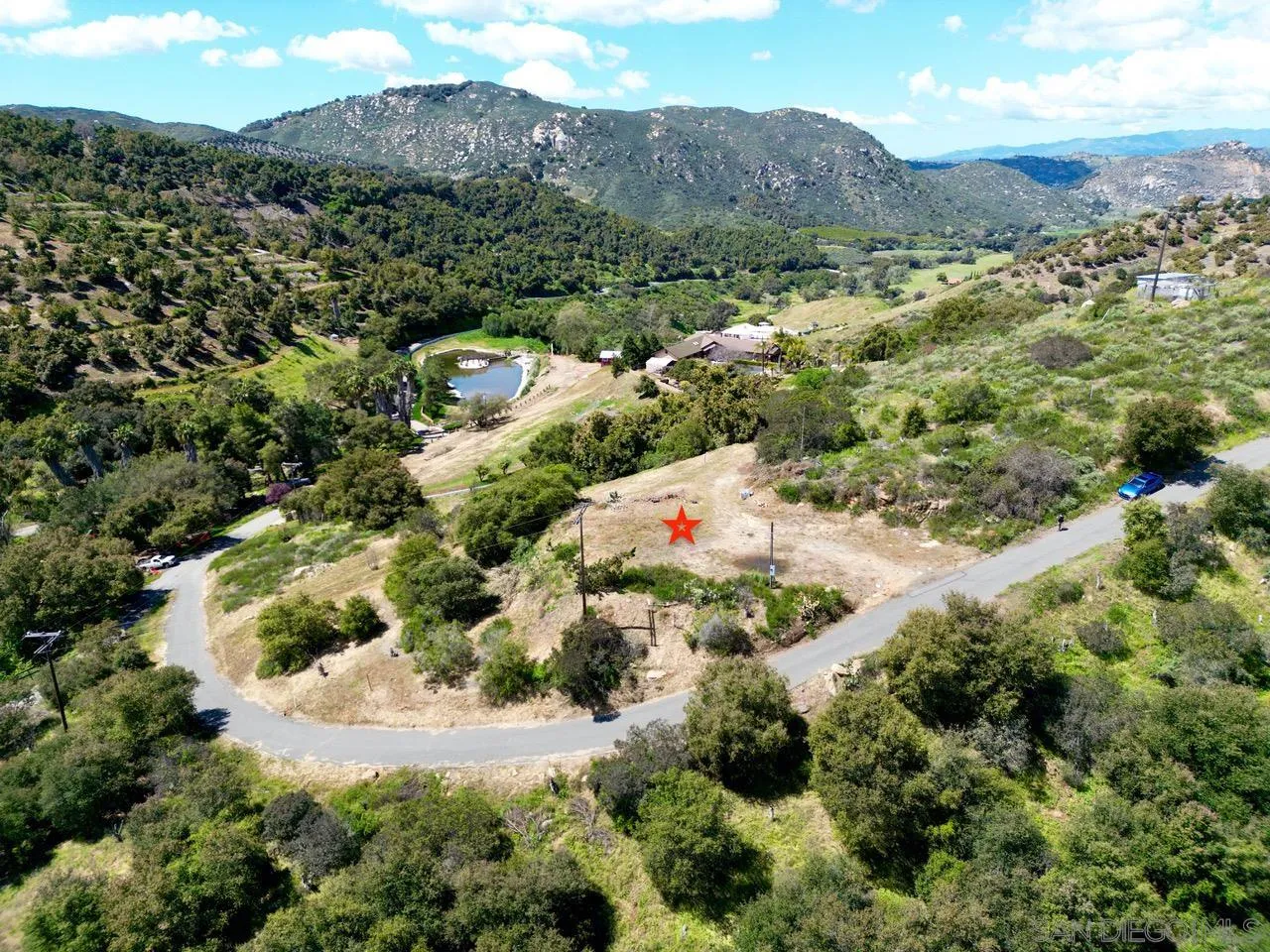 10448 Couser Way Valley Center, CA 92082 - Photo 1 of 17 an aerial view of mountain with residential houses