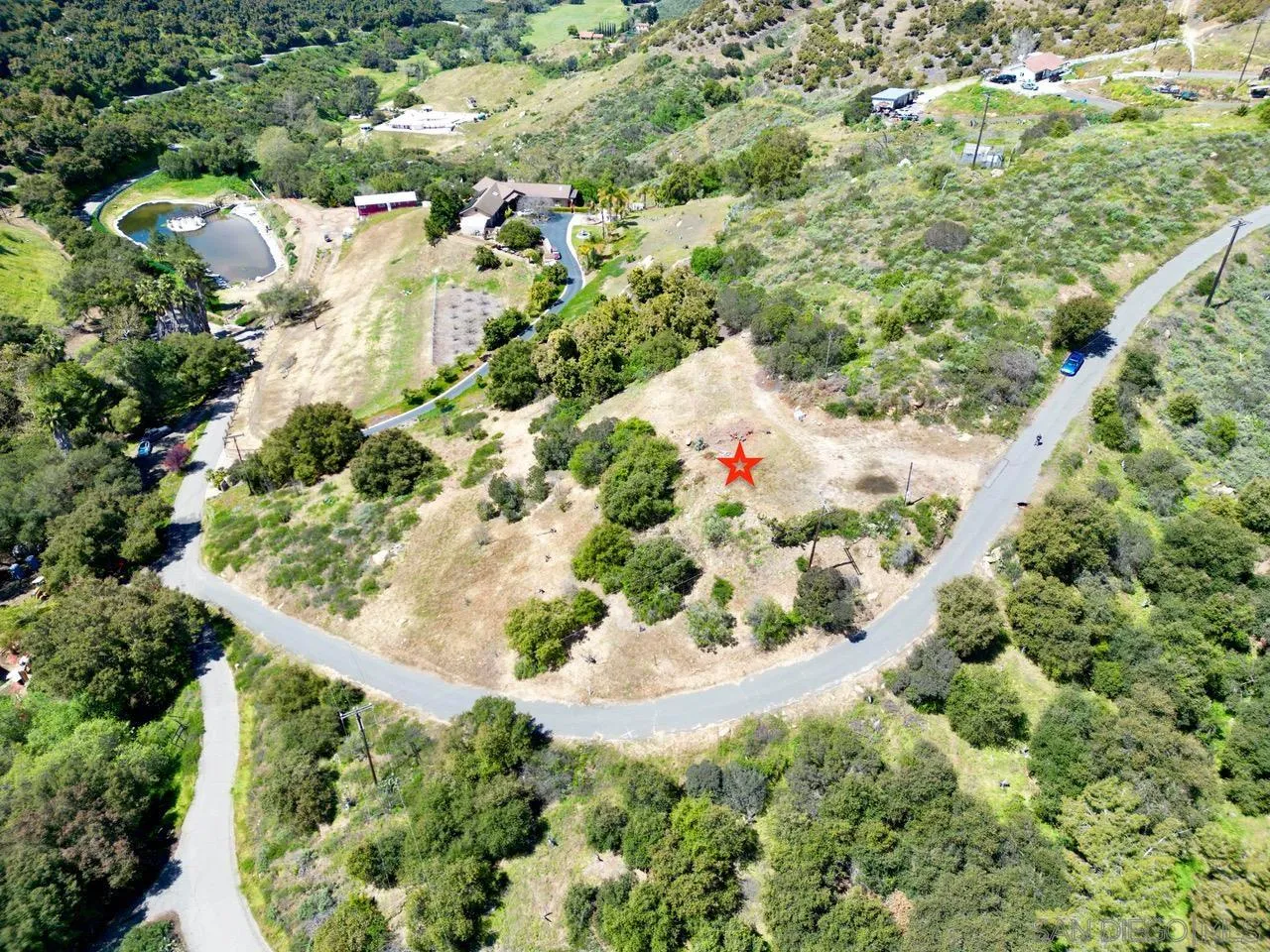 10448 Couser Way Valley Center, CA 92082 - Photo 3 of 17 a view of a garden with a tree