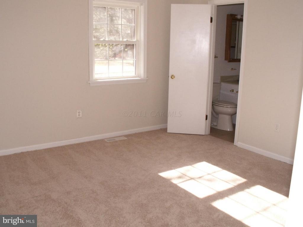 163 Windjammer Road Ocean Pines, MD 21811 - Photo 4 of 8 an empty room with windows