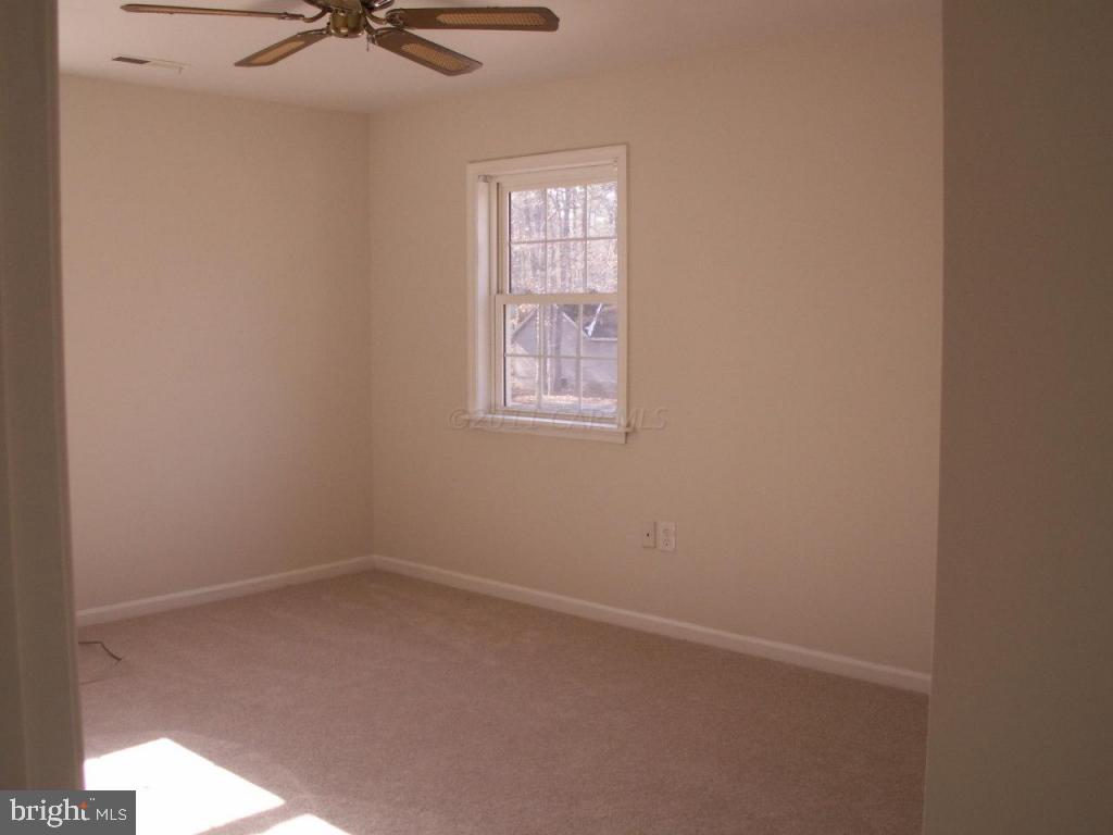 163 Windjammer Road Ocean Pines, MD 21811 - Photo 5 of 8 an empty room with a window