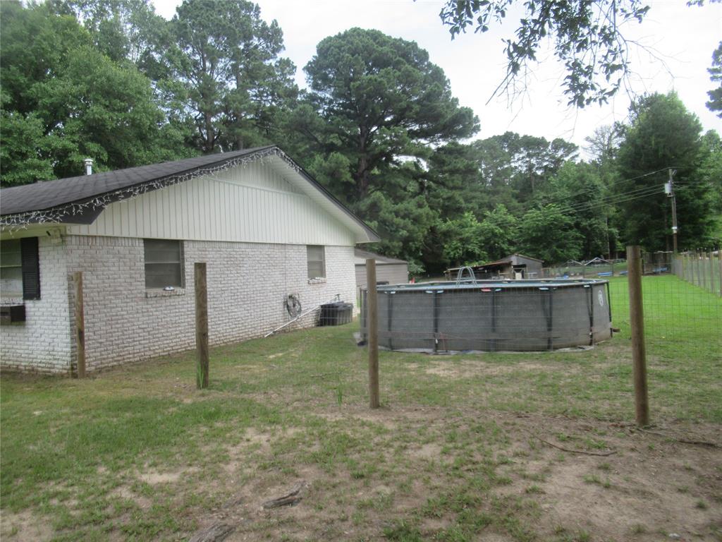 24133 Highway 157 Springhill, LA 71075 - Photo 2 of 19 Side of house featuring the pool